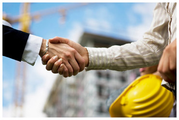 shaking hands on construction site - support
